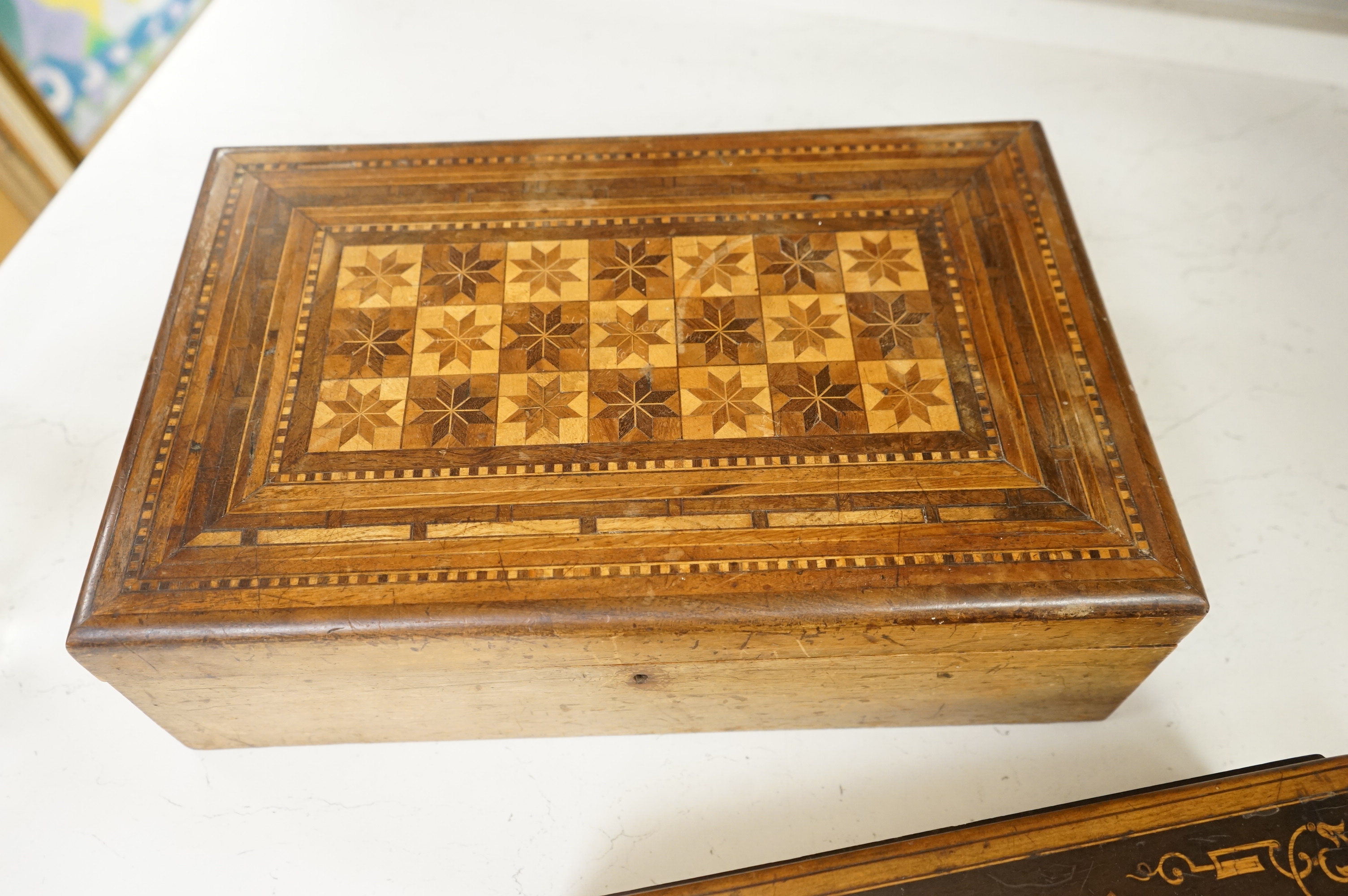 Three boxes comprising a Sorrento ware glove box, a marquetry inlaid slope and a rosewood dressing box, largest 39cm wide